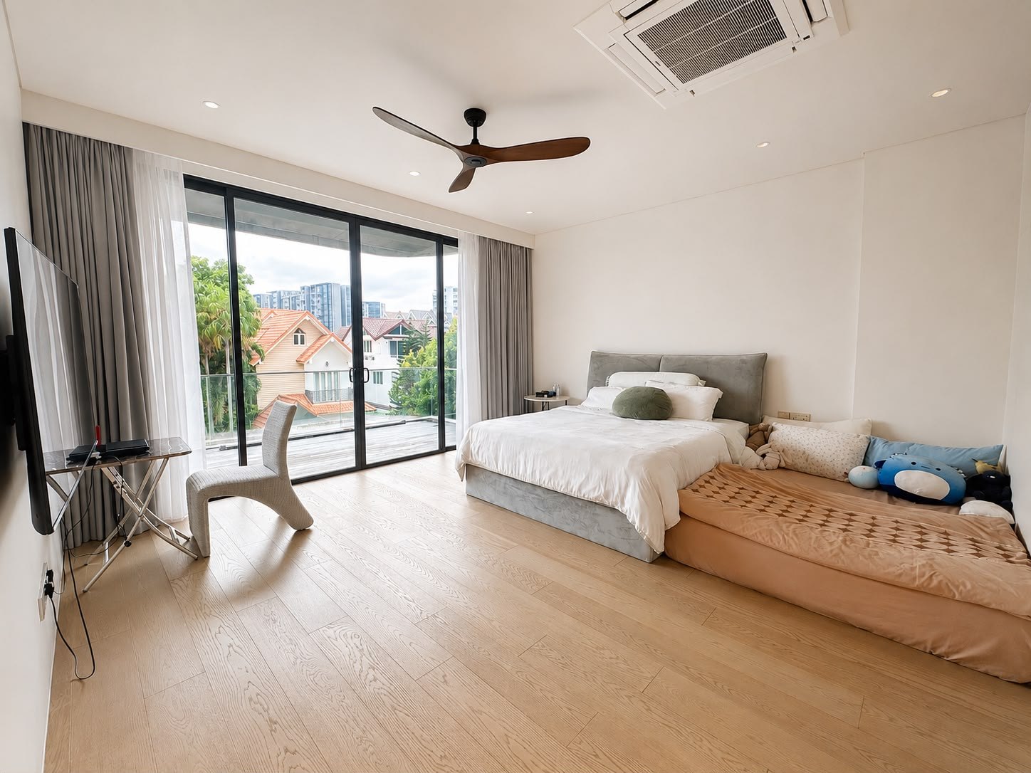 Bedroom opening to a balcony